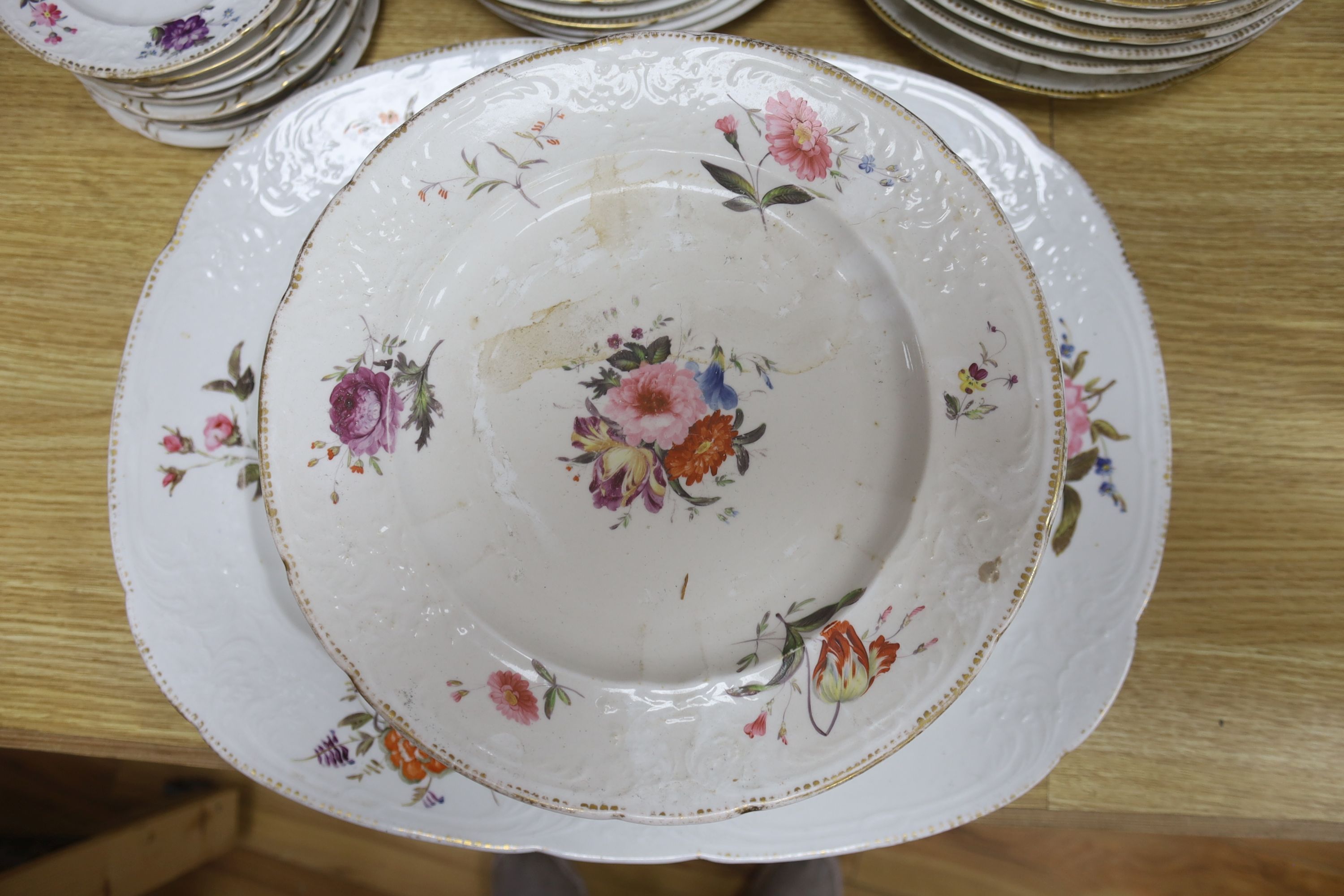 An English porcelain part dinner service, c.1825-30, and other similar plates